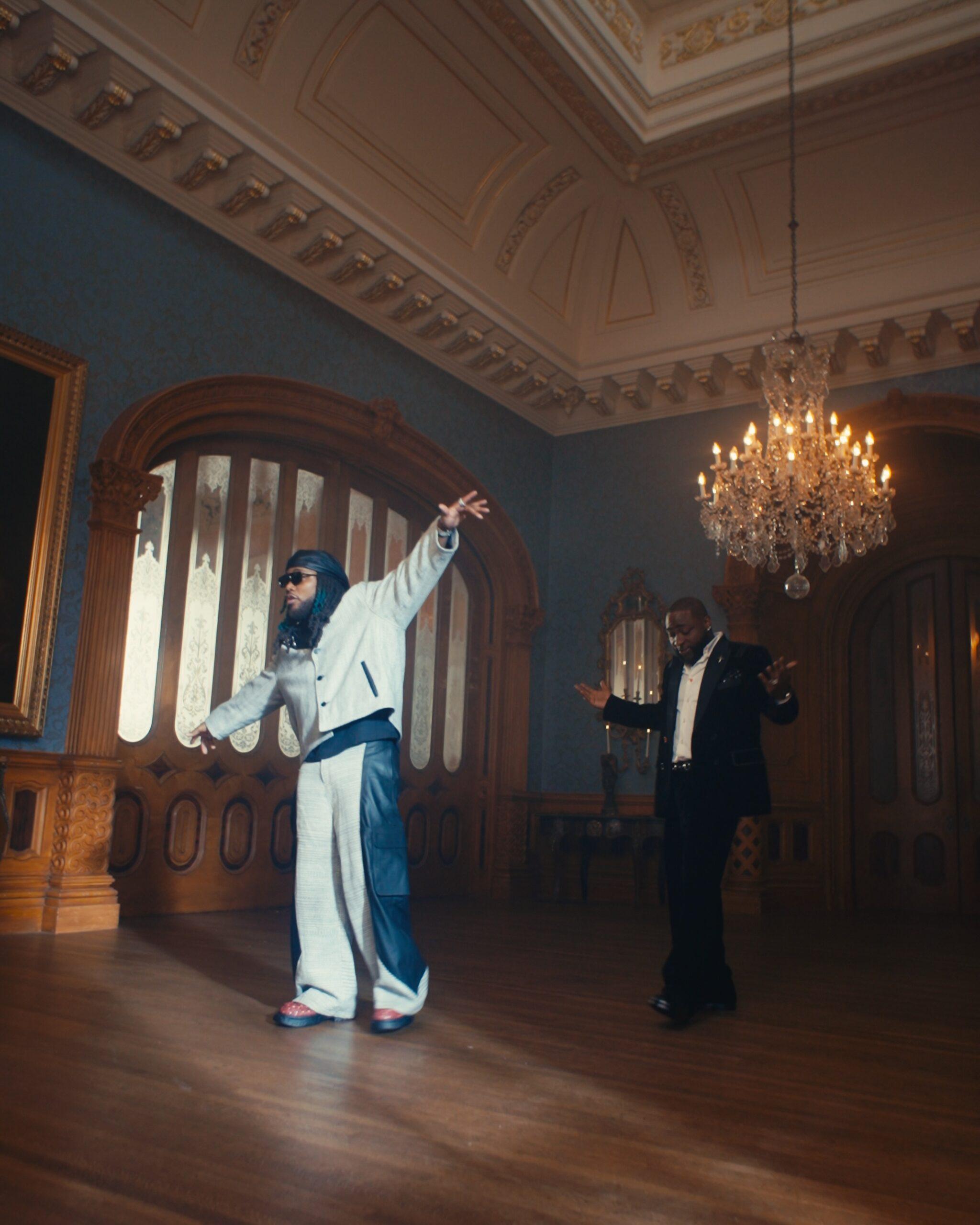 Davido performing in the Tell Everybody music video with Leon Thomas