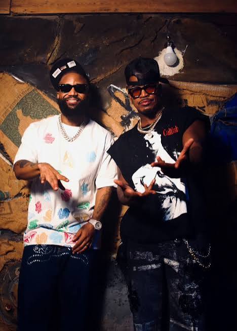 Cassper Nyovest posing with Ne-Yo after confirming new music together